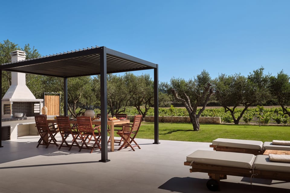 The shaded dining area, with BBQ creates the perfect poolside setting for slow l