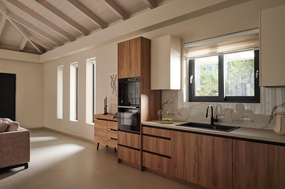 A seamless open-plan living and kitchen area opens directly to the pool, creatin