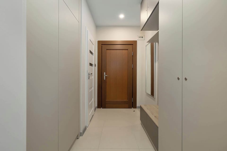 Modern Entrance Area with Spacious Wardrobes and Storage Solutions