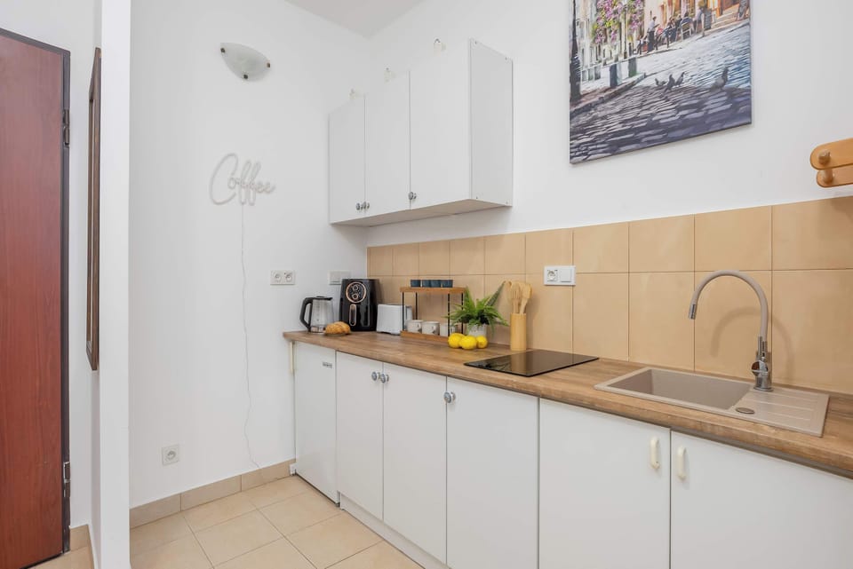 Well-Equipped Kitchen with Modern Appliances and Dining Essentials