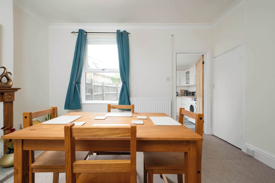 The dining area offers a bright and homely atmosphere, creating the perfect setting for enjoying meals together, catching up over coffee, or planning the day ahead.