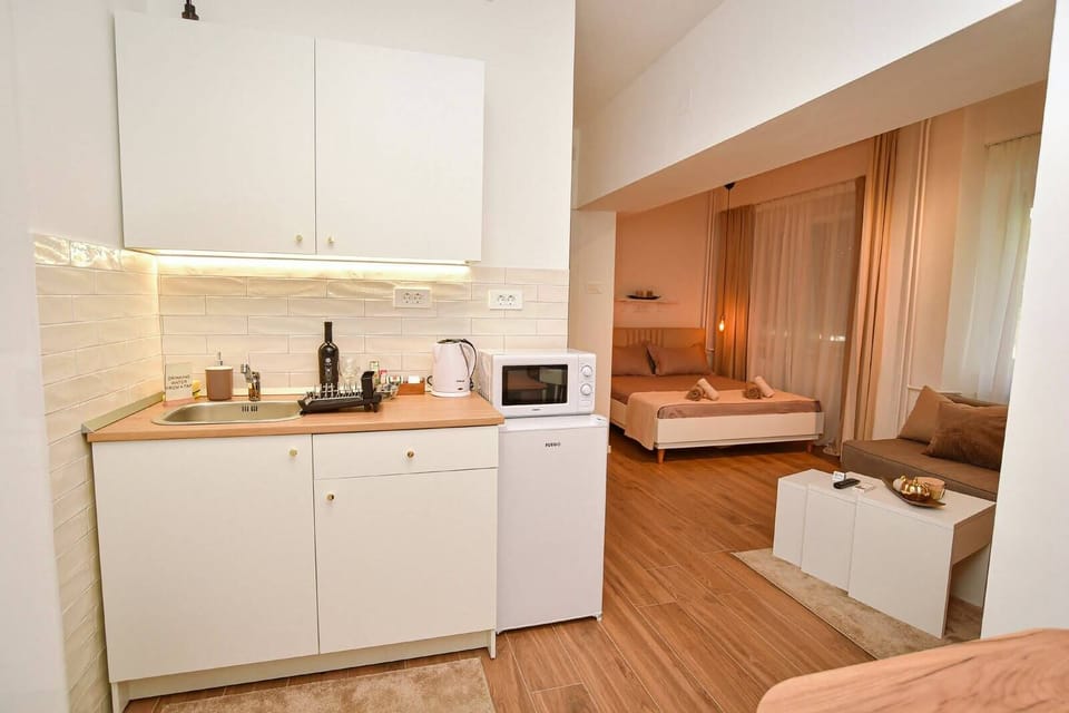 microwave, kitchenette, coffee and coffee maker, kettle, refrigerator 