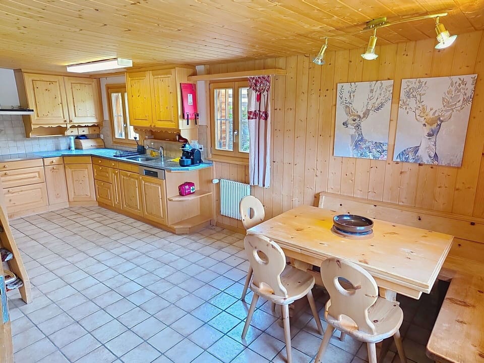 Wood, Floor, Kitchen, Wood Stain, Hardwood, Cabinetry, Countertop, Chair, Kitchen & Dining Room Table, Log Cabin