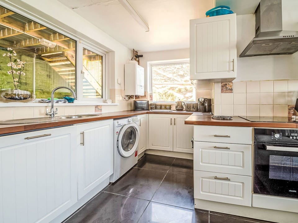 Interior Design, Major Appliance, Kitchen, Flooring, Countertop, Wood, Kitchen Appliance, Cabinetry, Floor, Ceiling