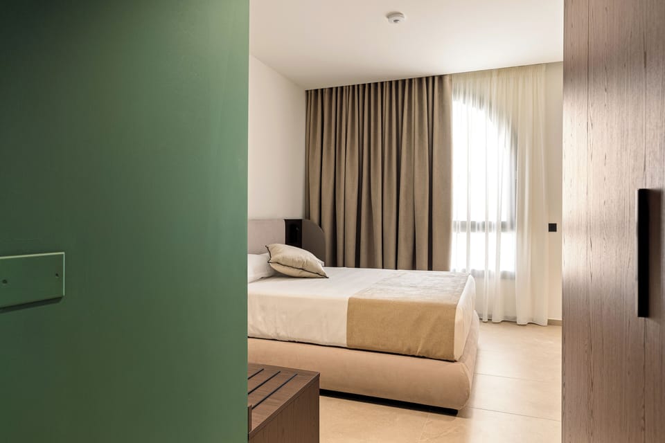 Superior Double Room, Courtyard View | In-room safe, desk, laptop workspace, blackout drapes