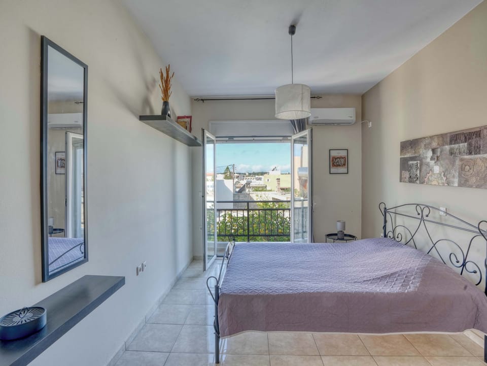 Wake up to natural light and a peaceful atmosphere in a bedroom designed for restful island mornings.