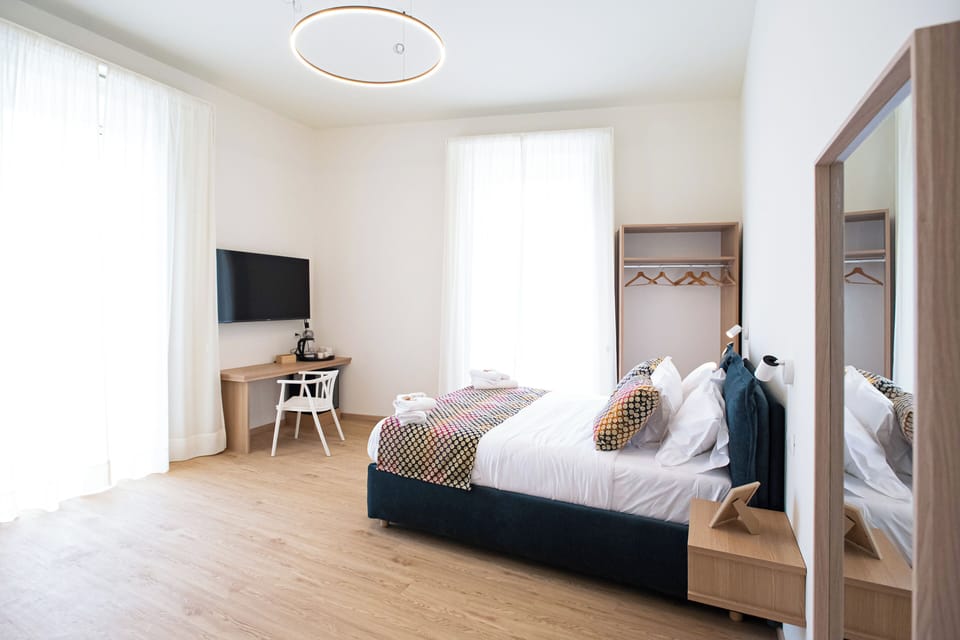 Family Quadruple Room, City View | In-room safe, desk, free WiFi
