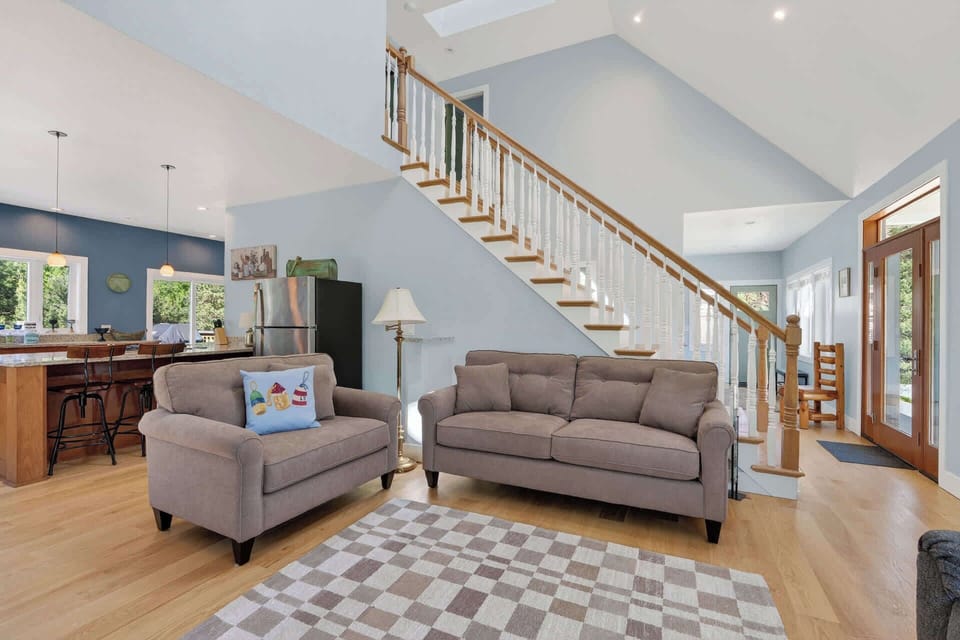 Large living room with fire place and TV