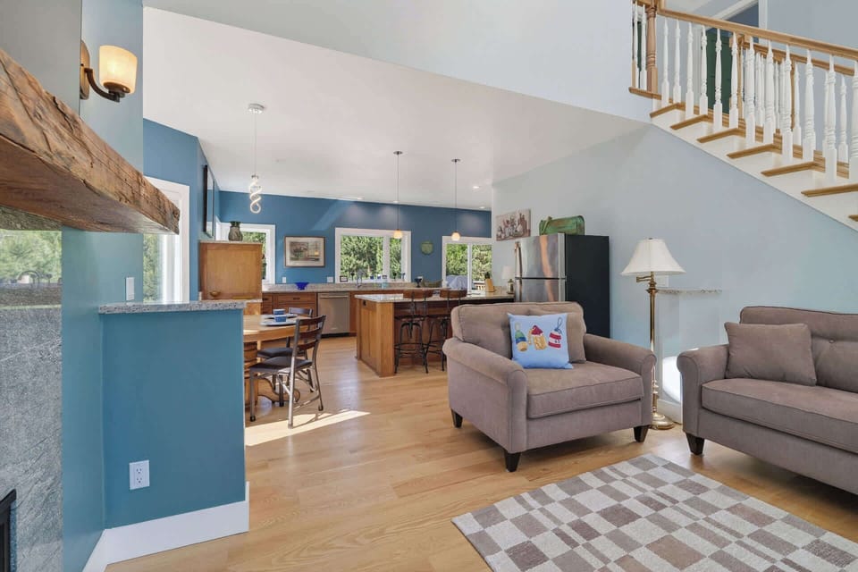 Large living room with fire place and TV