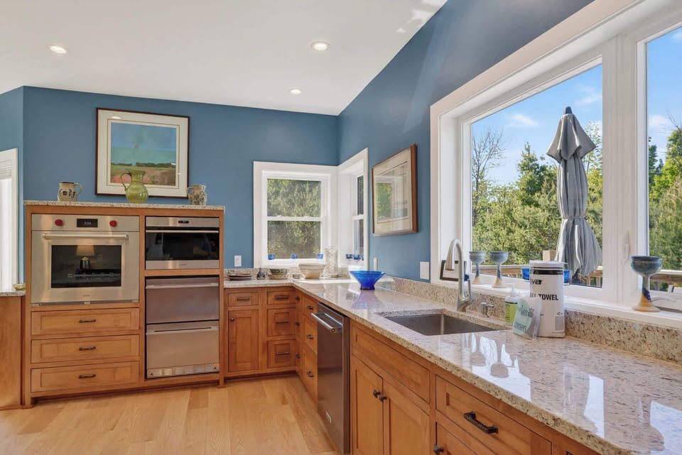 Granite Countertops and Wolf appliance throughout kitchen