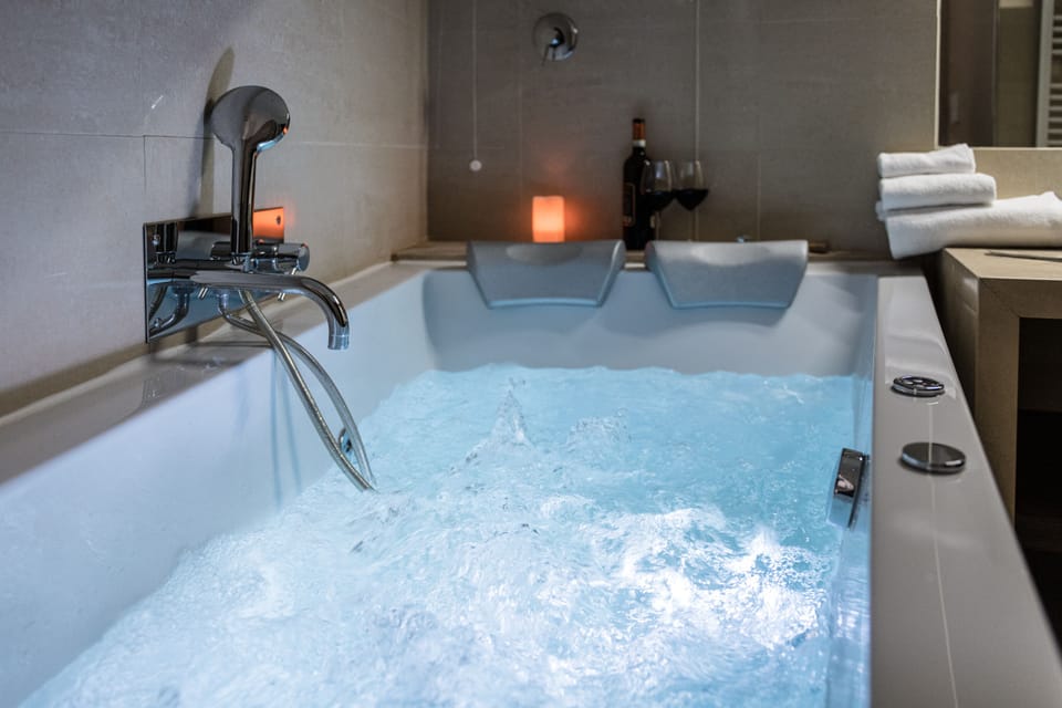 Romantic Studio Suite, Hot Tub | Bathroom | Free toiletries, hair dryer, bidet, towels