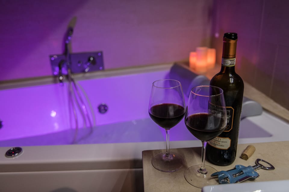 Romantic Studio Suite, Hot Tub | Bathroom | Free toiletries, hair dryer, bidet, towels