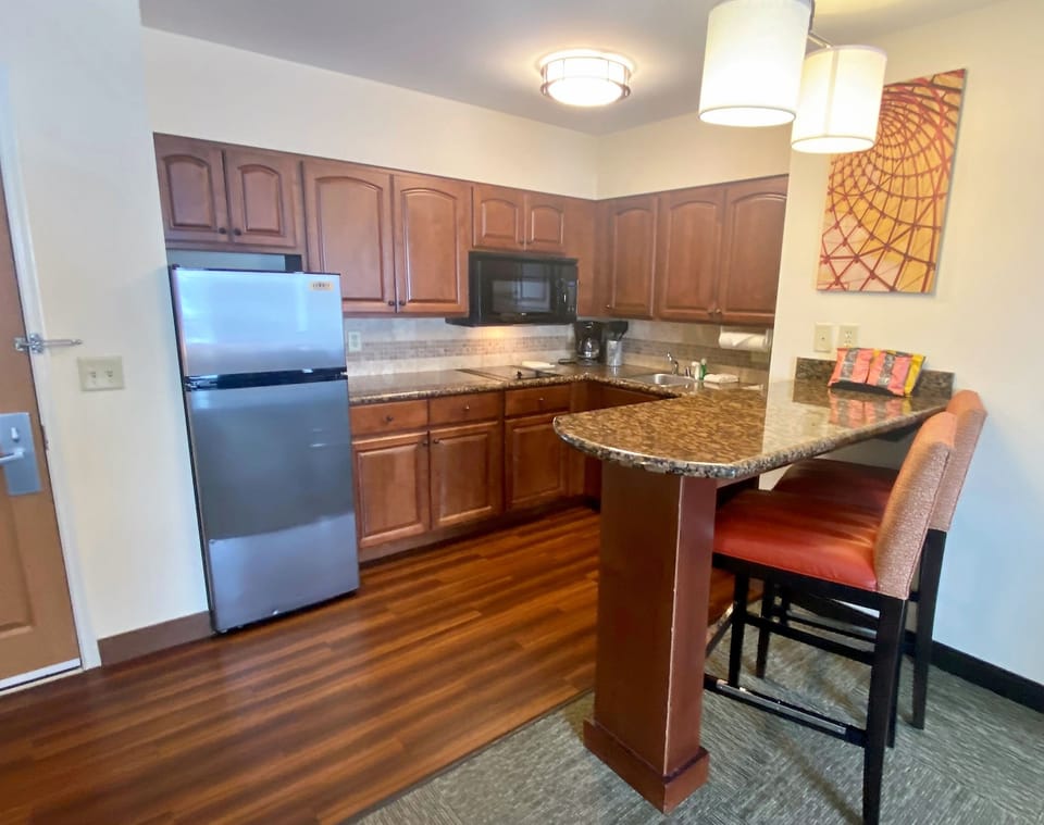 Gather around the stylish breakfast bar, perfect for enjoying a quick meal before your day's adventures.