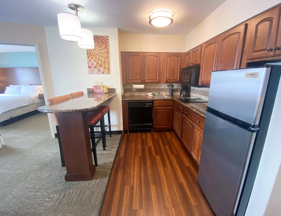 Effortlessly entertain in this open kitchen layout, designed for functionality and style.