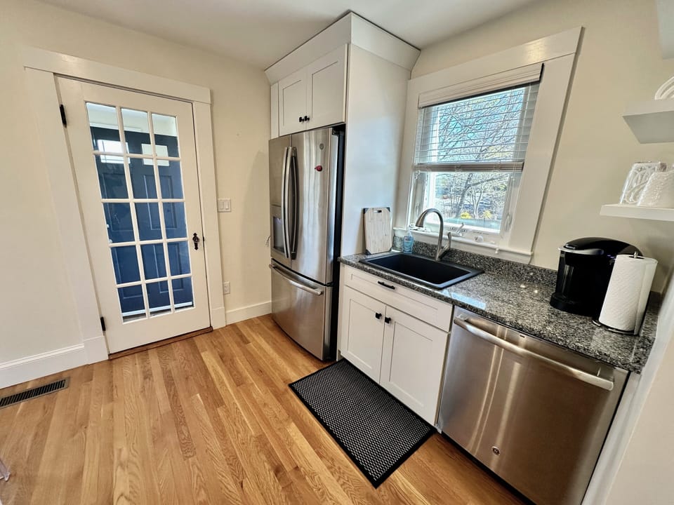 Off the kitchen is a pantry/mudroom with a door leading to the side porch.
