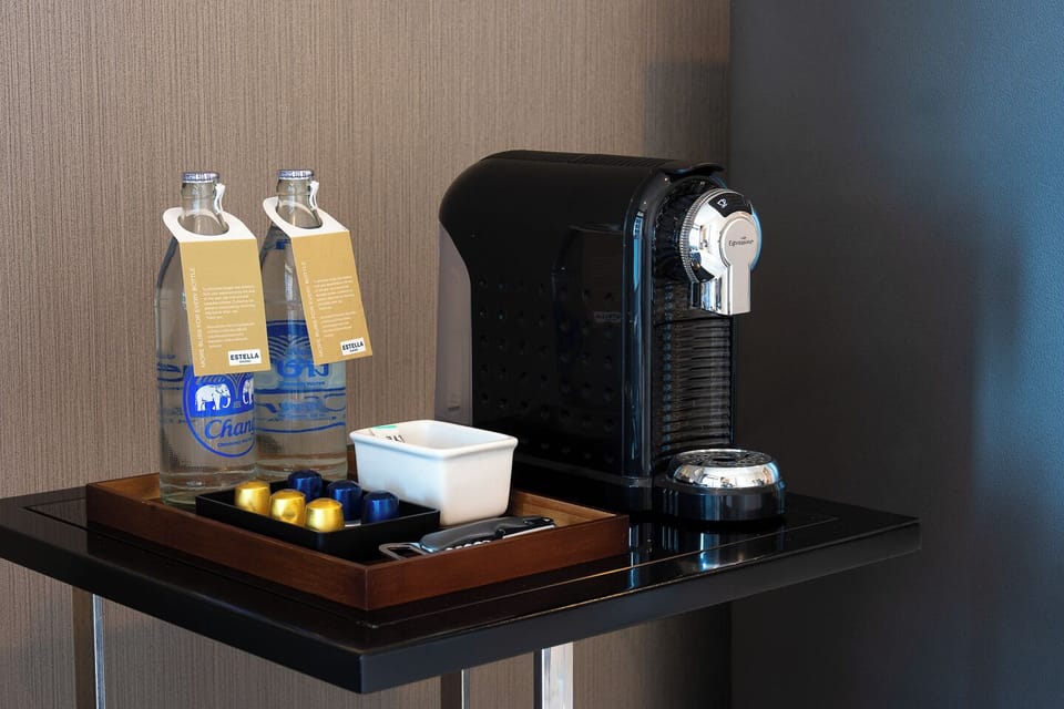 Convenient in-room coffee station with espresso machine and bottled water