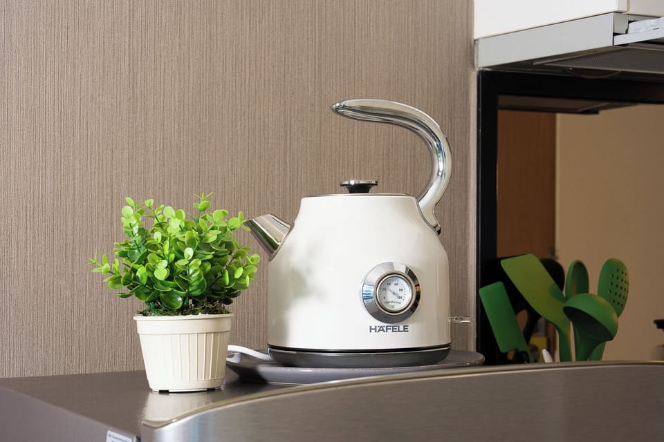Modern kitchen with electric kettle and fresh, stylish touches