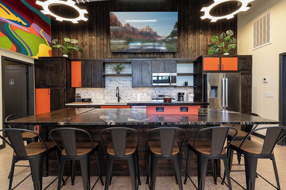 Sleek and fully equipped kitchen at Bike Barn, Kanab, UT. Enjoy cooking and dining with modern amenities and stylish design.