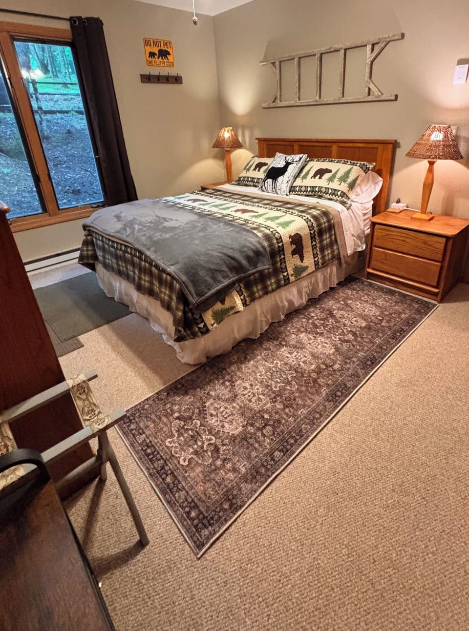Downstairs bedroom with comfortable bedding and cozy decor.