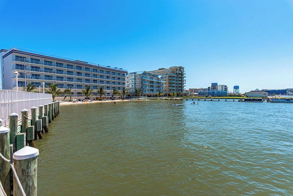 Waterfront stay with sandy beach, marina views and calm bay vibes.