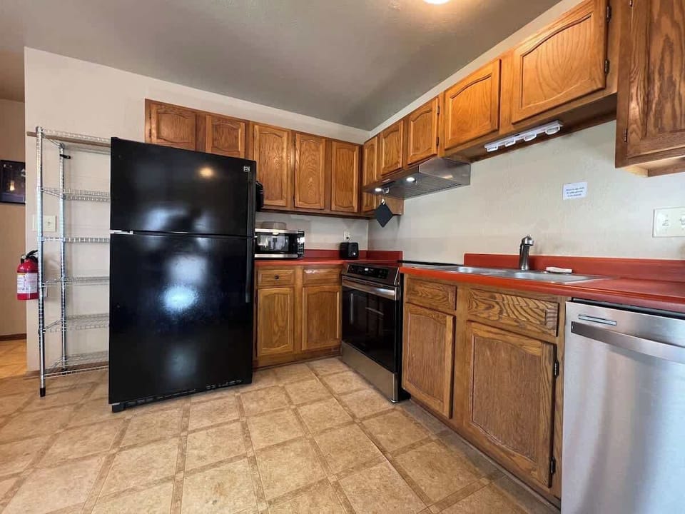 Kitchen with refridgerator, microwave and toaster