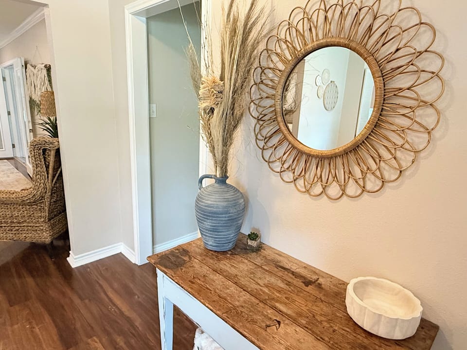 Entry table with a place to put your keys and check your face before you leave.