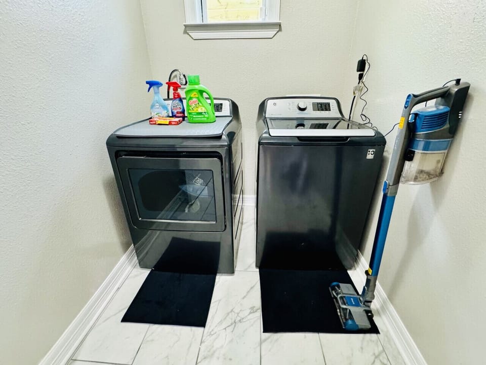 Laundry room with full-size washer and dryer