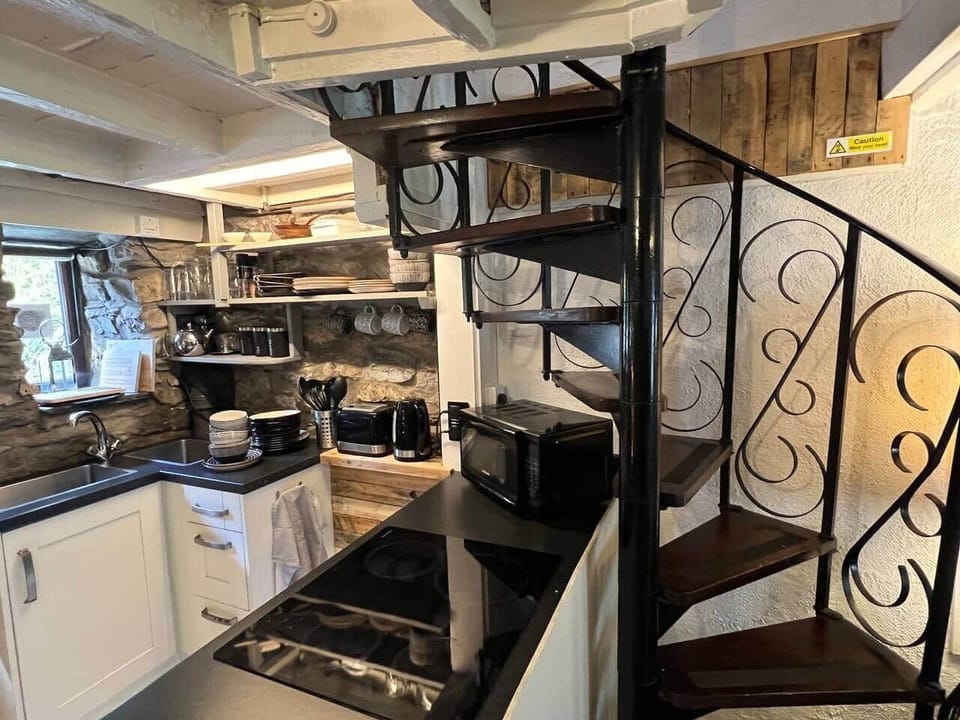 Spiral stairs and kitchen