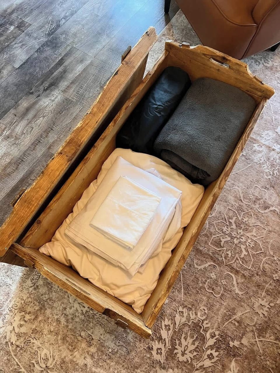 Queen air mattress with linens provided in sofa table