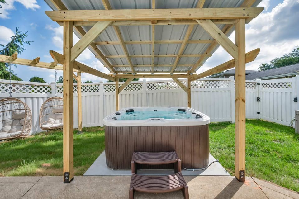 Private hot tub tucked under a pergola, perfect for evening soaks