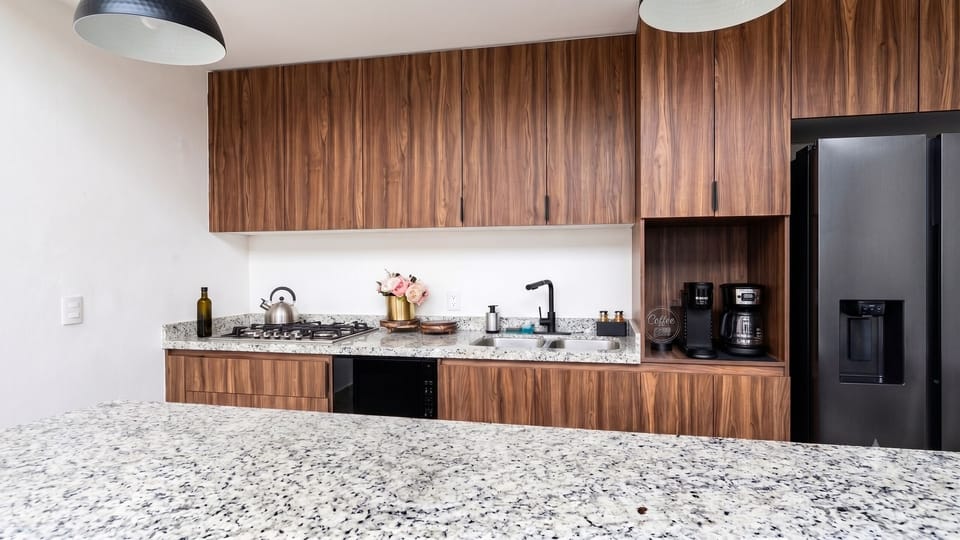 Luxury Apartment | Private kitchen | Stovetop, eco-friendly cleaning products, paper towels, kitchen islands