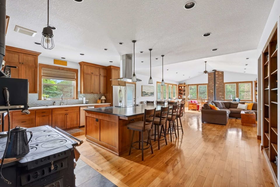 Kitchen and living area with island seating.