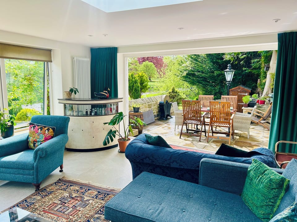 Open the bifold doors in the River Room to the patio, garden and riverbank. 