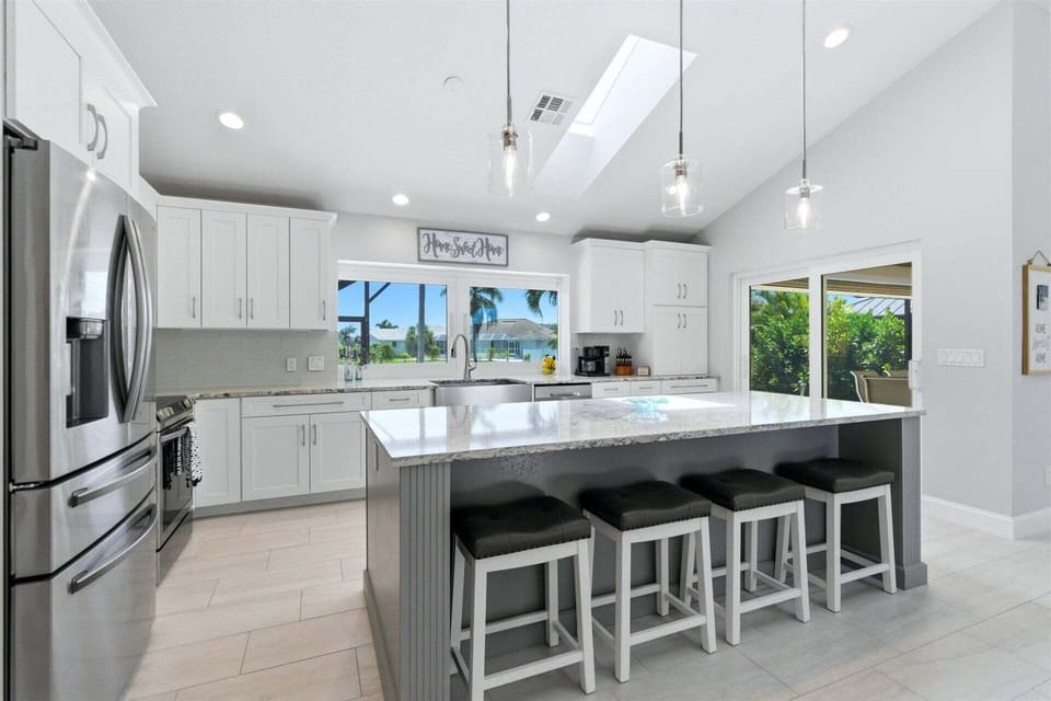 Beautiful, bright, fully-equipped kitchen with huge pass-through window