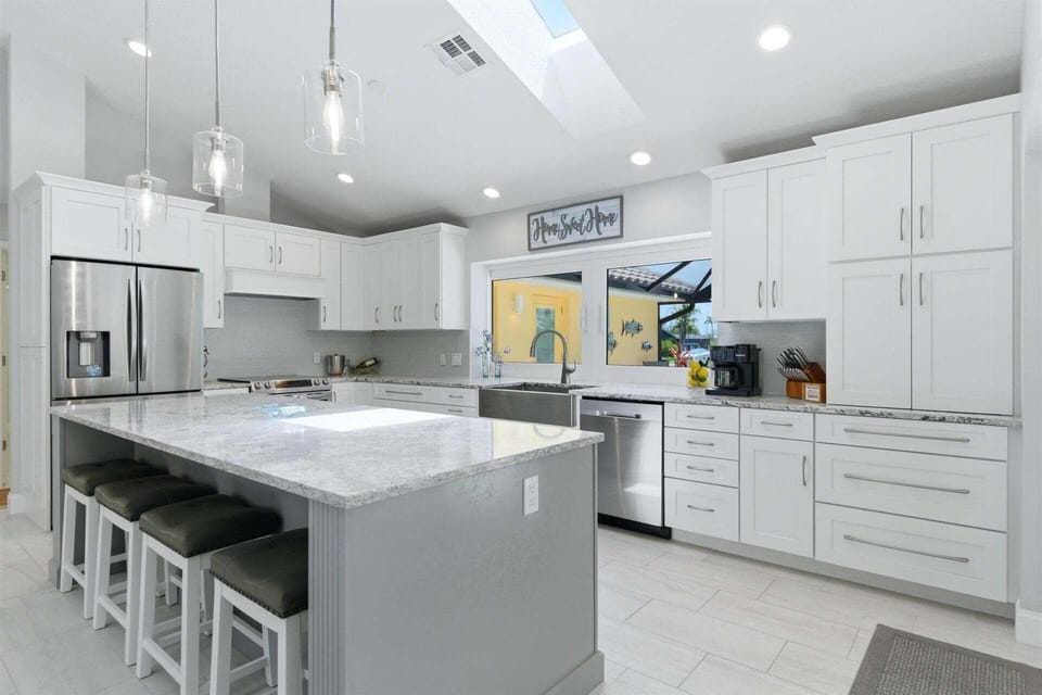 Beautiful, bright, fully-equipped kitchen with huge pass-through window