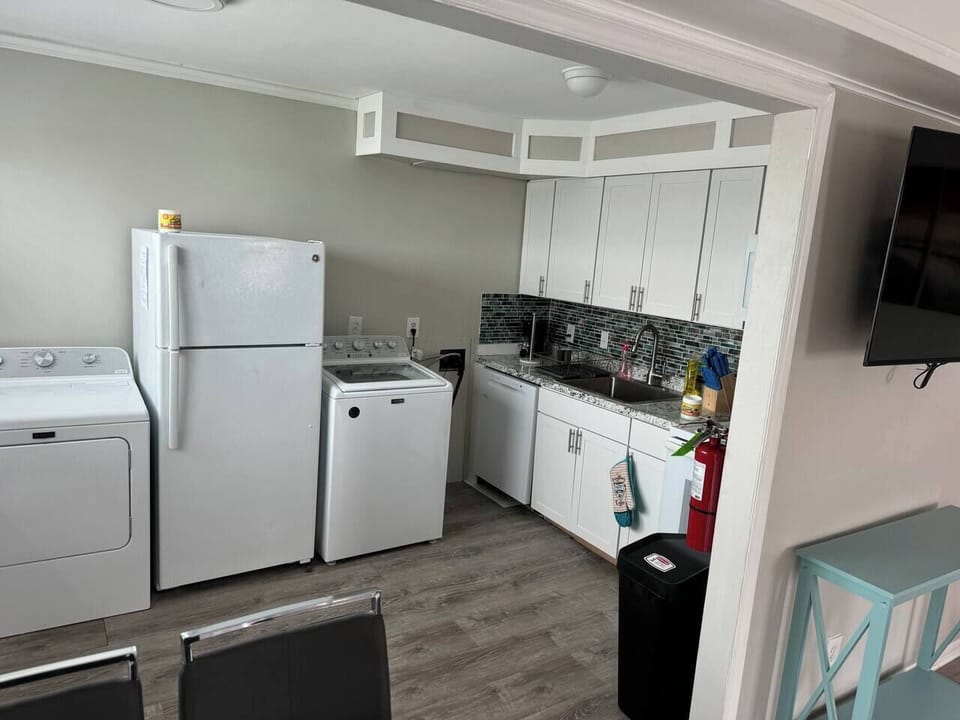 Kitchen with washer and dryer
