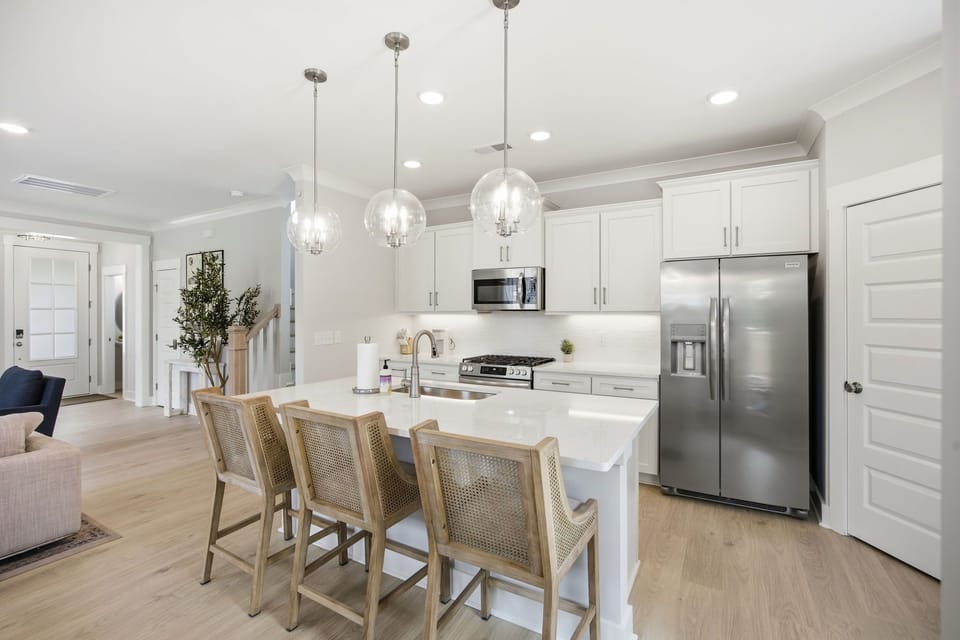 There's plenty of room to cook a meal here. The cabinets are fully stocked with dinnerware, flatware, glasses, wine glasses, rocks glasses, coffee mugs, children's dining, and all the pots/pans you'll need if you decide not to venture downtown.