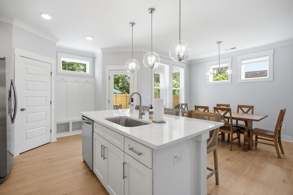 The kitchen includes a large pantry that includes some board games and a first aid kit along with a vestibule to hang your coats and some lower storage.