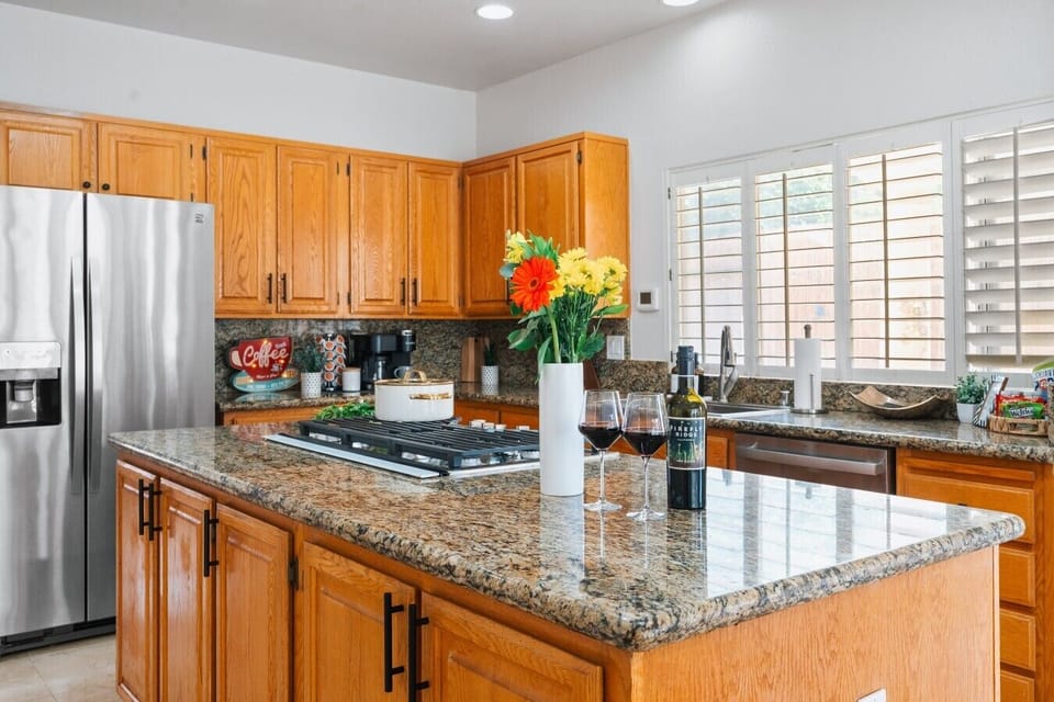 Kitchen: The ultimate setup for hosting wine and cheese nights where conversations flow as freely as the drinks.