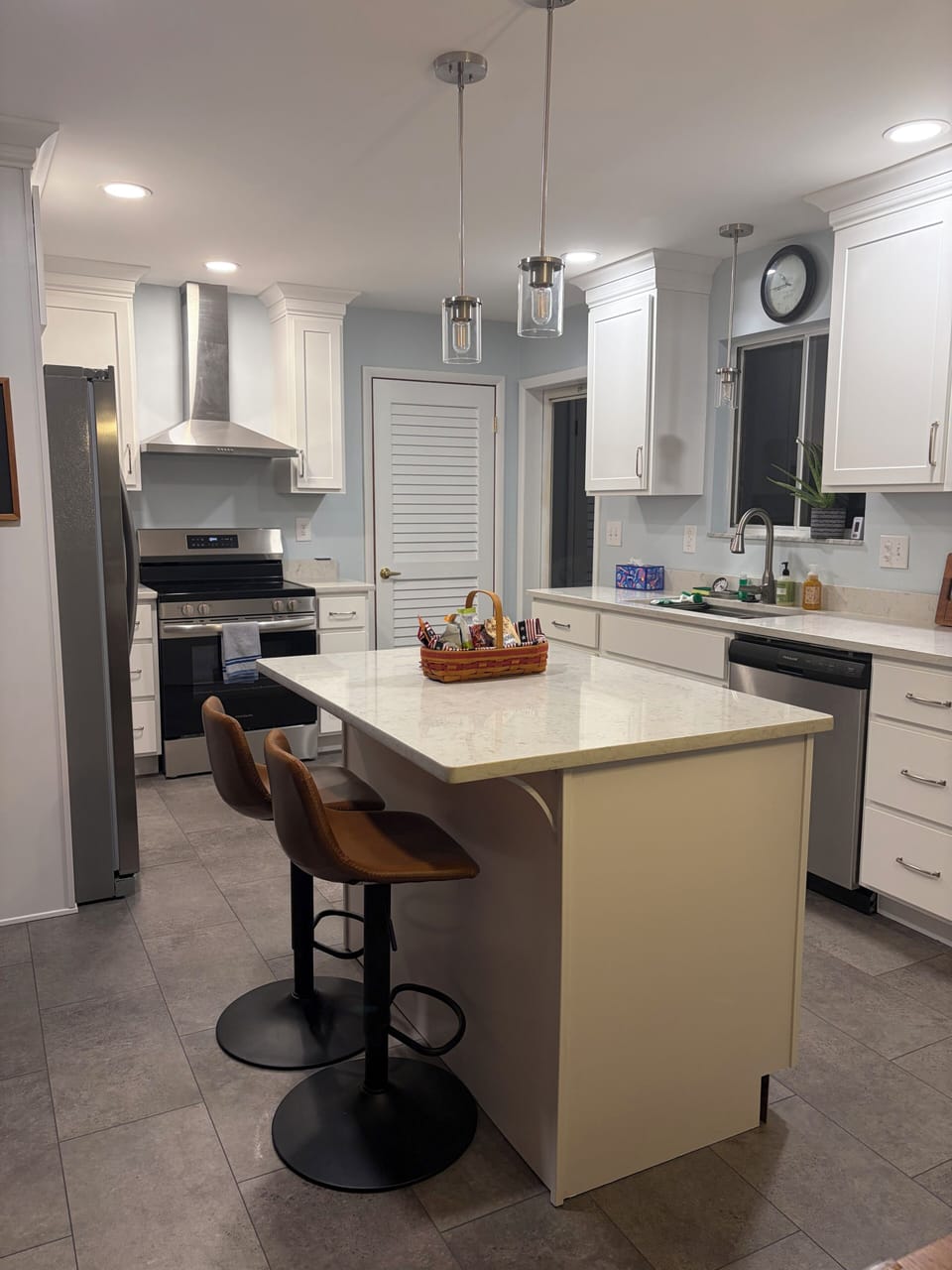 Well-equipped kitchen redone in 2025. Handy cleaning supplies under sink.
