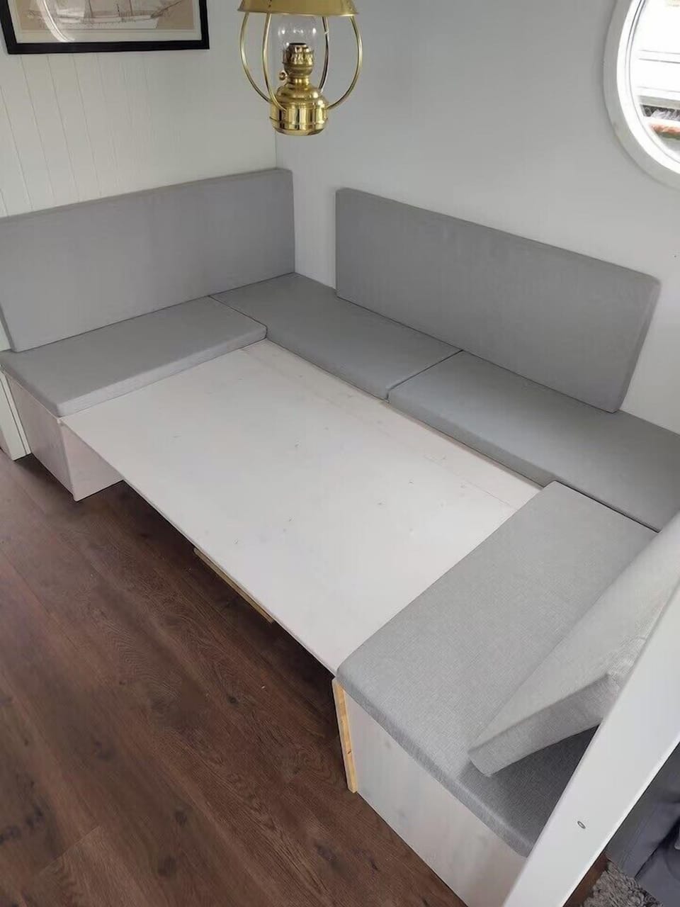 Lower the table by loosening the handle underneath and press it down. complete with the extra board to get full width.