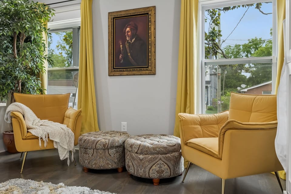 Living Room: The cozy living area offers plush seating, natural light, and a welcoming atmosphere. Whether you're streaming your favorite show or enjoying conversation, it's the perfect place to gather.