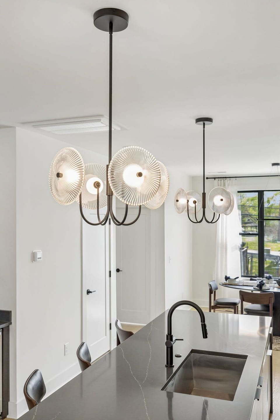 Kitchen: A modern kitchen with sleek cabinetry, stainless steel appliances, and ample counter space.
