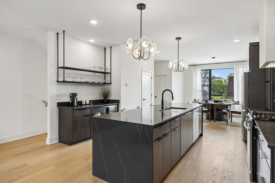 Kitchen: A modern kitchen with sleek cabinetry, stainless steel appliances, and ample counter space.