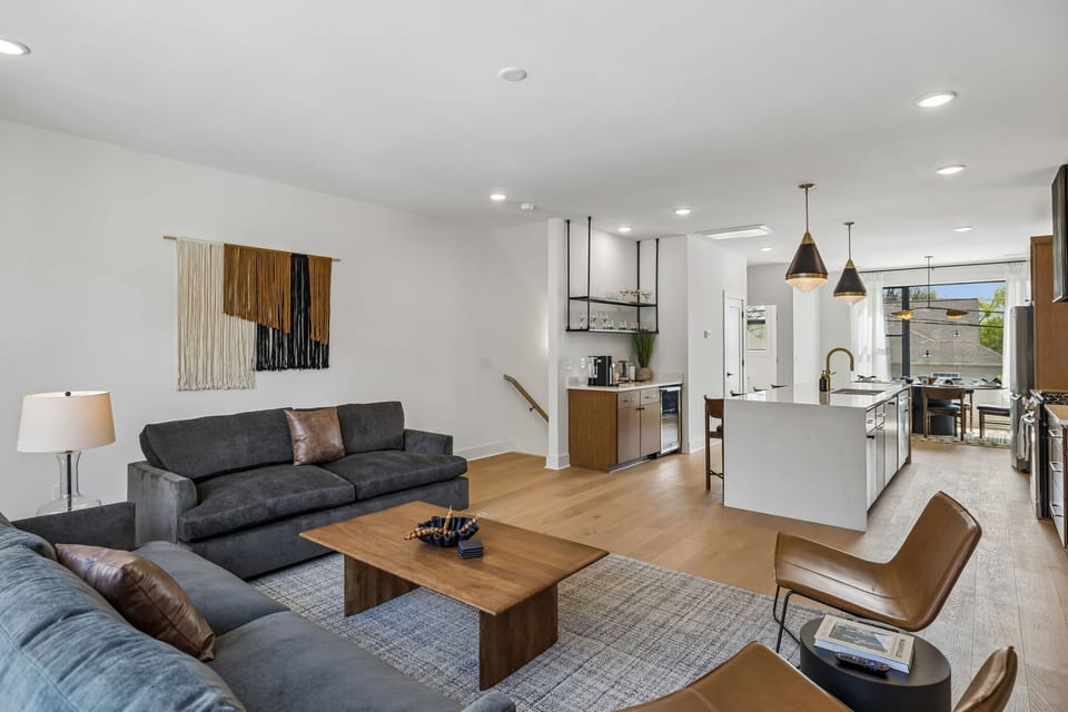 Living Room: Unwind in this cozy living space featuring plush seating, stylish décor, and a smart TV, creating the perfect spot for movie nights and downtime.