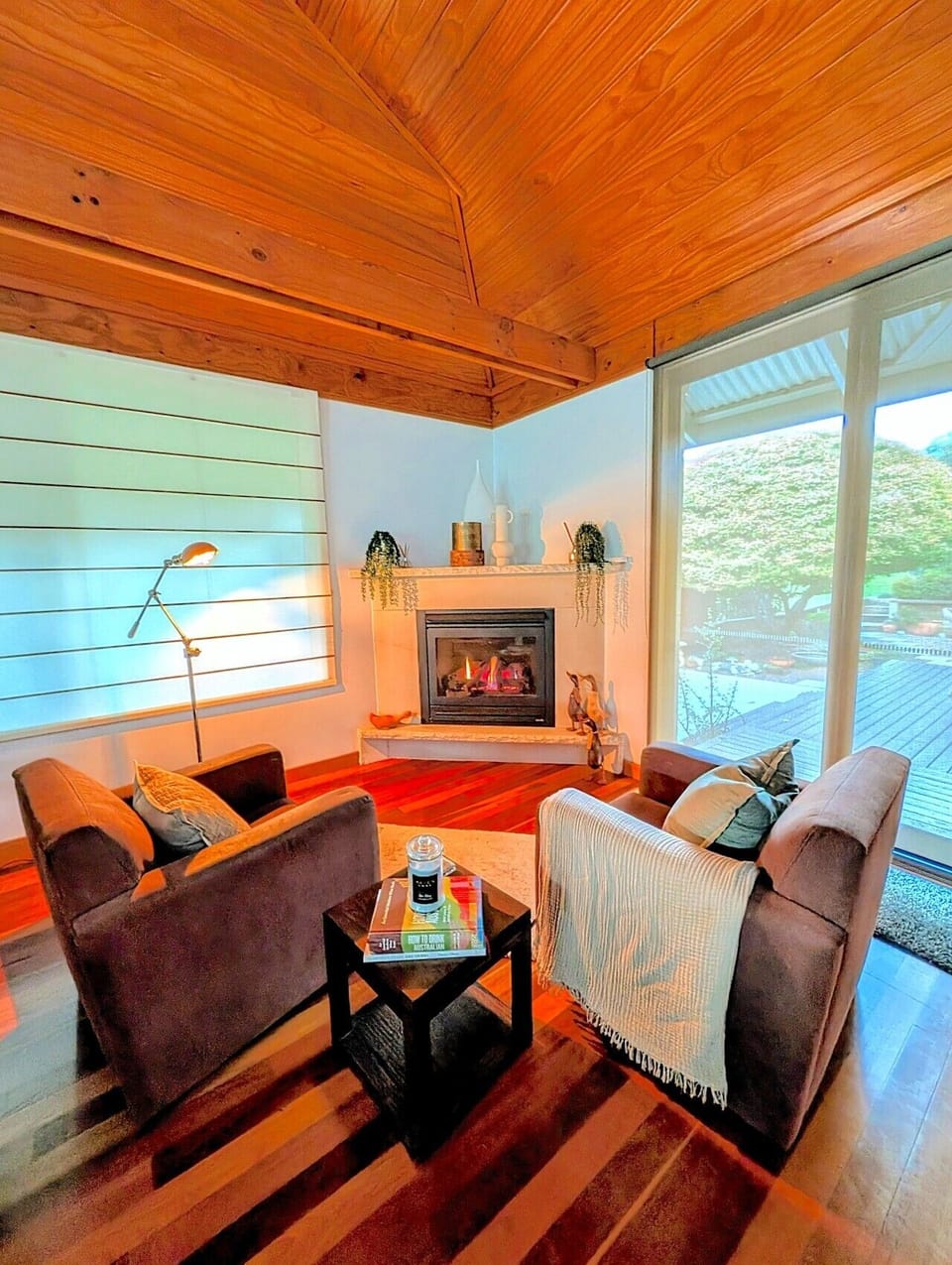 Gas log fireplace at the heart of the living room — the natural gathering point after a day in the Hunter Valley vineyards. A perfect place to curl up with a book, a glass of wine of hot chocolate.