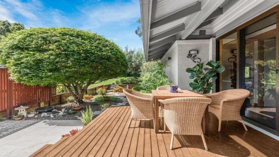 A private rear escape centred around the property`s iconic Japanese maple, with dining and firepit*, stepping stone garden path and direct access to parkland for the kids or dogs. Perfect for a peaceful morning coffee on the courtyard deck