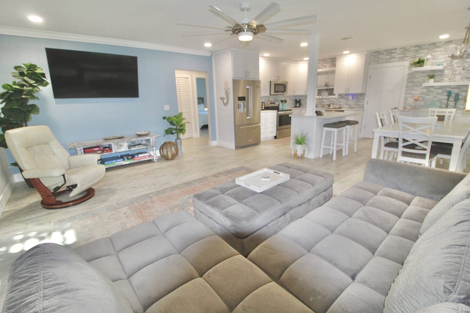 Gather together on the large comfortable couch to stream all your favorite apps and shows on the large screen Smart TV.