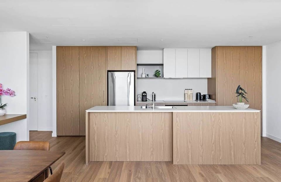 Modern, fully equipped kitchen with quality appliances and generous bench space — ideal for cooking, casual meals or morning coffee.