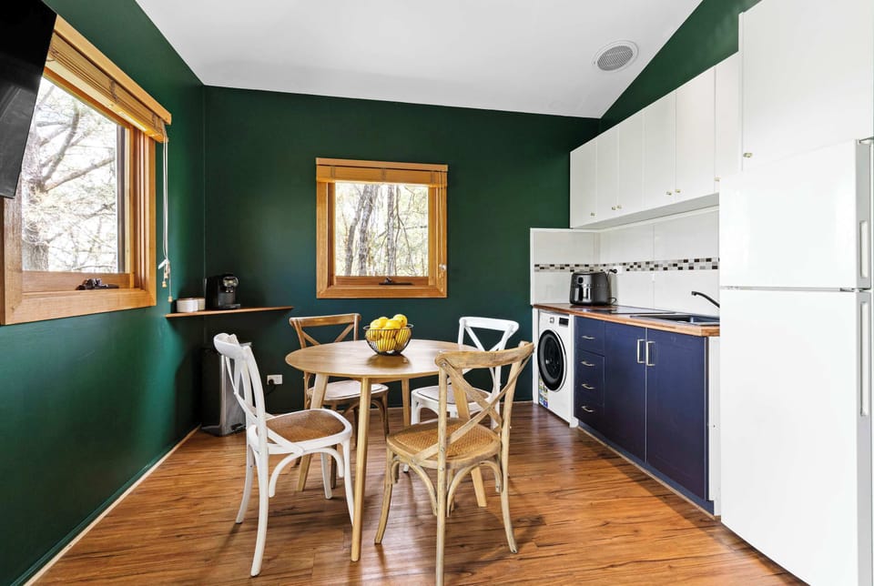Modern Kitchenette with cooktop, Air fryer and full fridge.